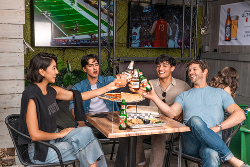 Beer and pizza on The Ivy Tavern's outdoor patio (